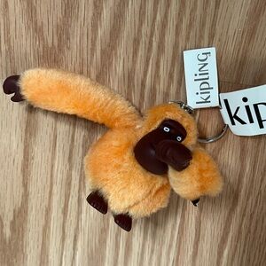 Kipling Vibrant Orange Plush Keychain